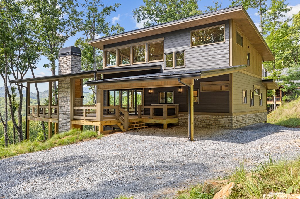 394 Mountain Trace Cherry Log, GA 30522 - Photo 66 of 70 a view of a house with a yard and wooden fence