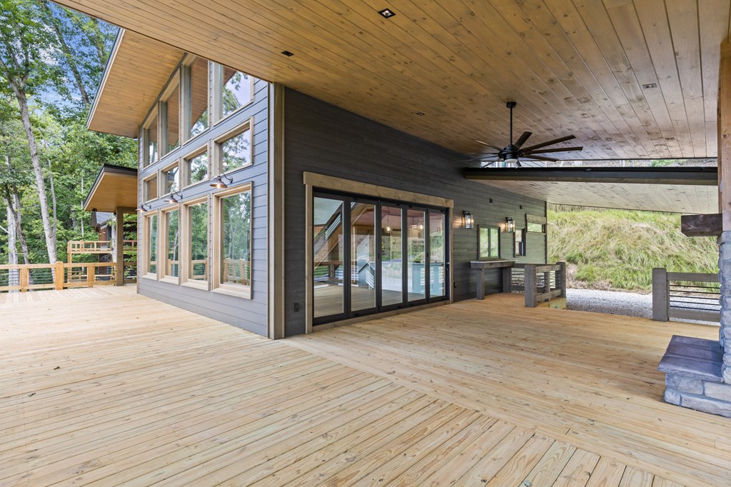 394 Mountain Trace Cherry Log, GA 30522 - Photo 8 of 70 a view of an empty room with a window and wooden floor