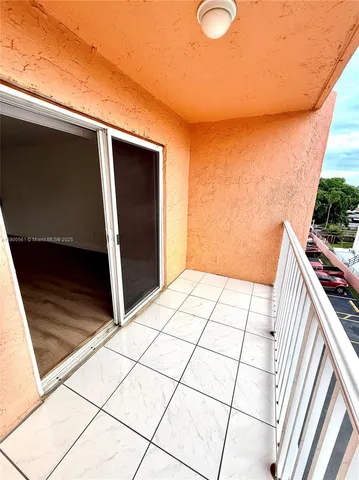 a view of an empty room and entryway