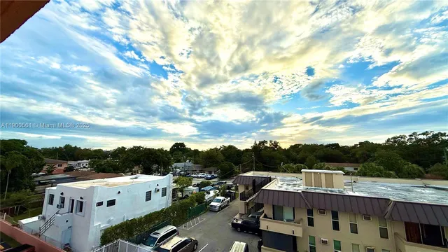 a view of city from balcony with seating