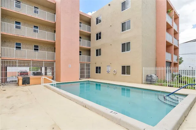 a view of a swimming pool with an outdoor space