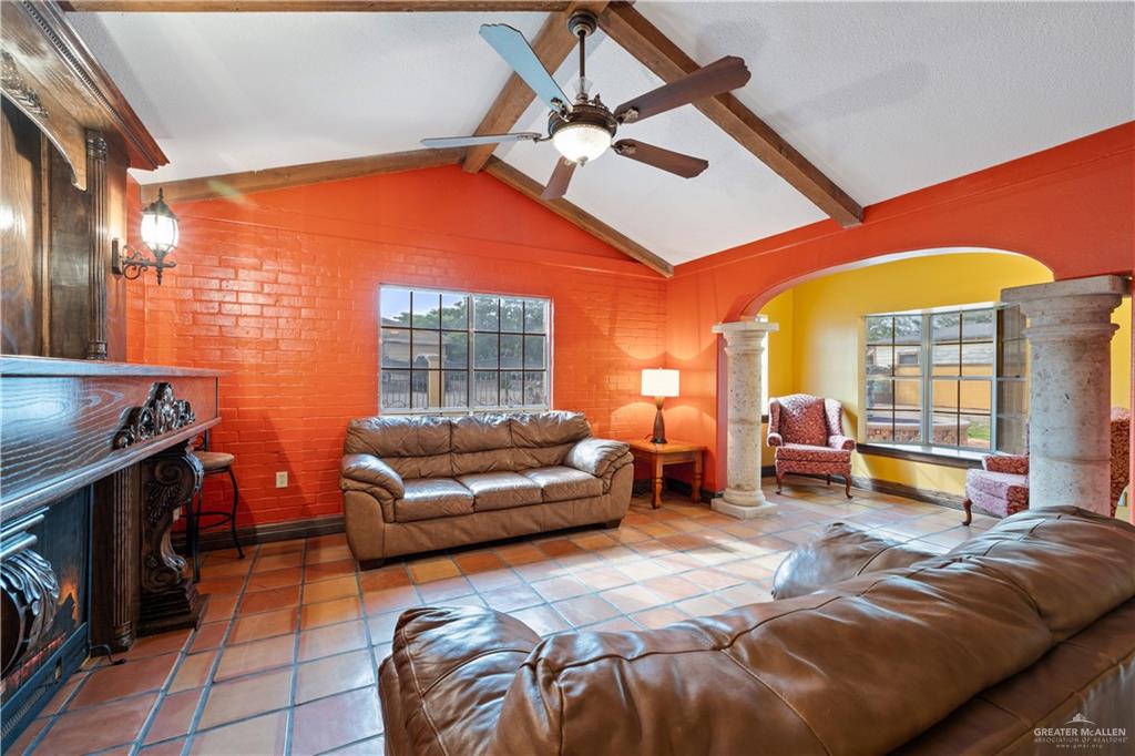610 North Texas Street Rio Grande City, TX 78582 - Photo 4 of 23 a living room with furniture and a floor to ceiling window