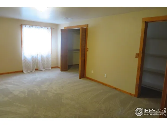 a view of an empty room and window