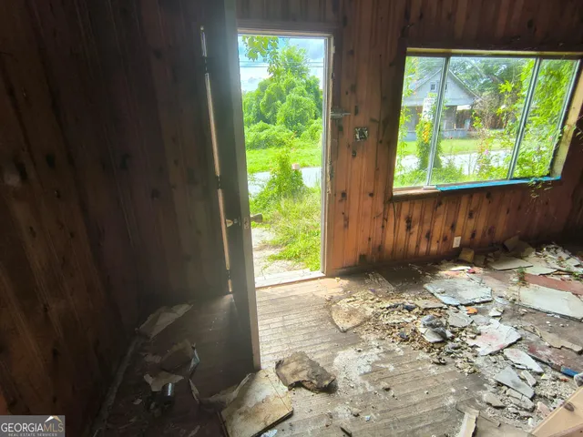 a backyard of a house with outdoor seating