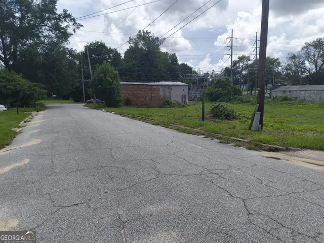 a front view of house with yard and trees