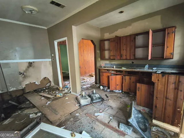 a kitchen with a stove and a refrigerator
