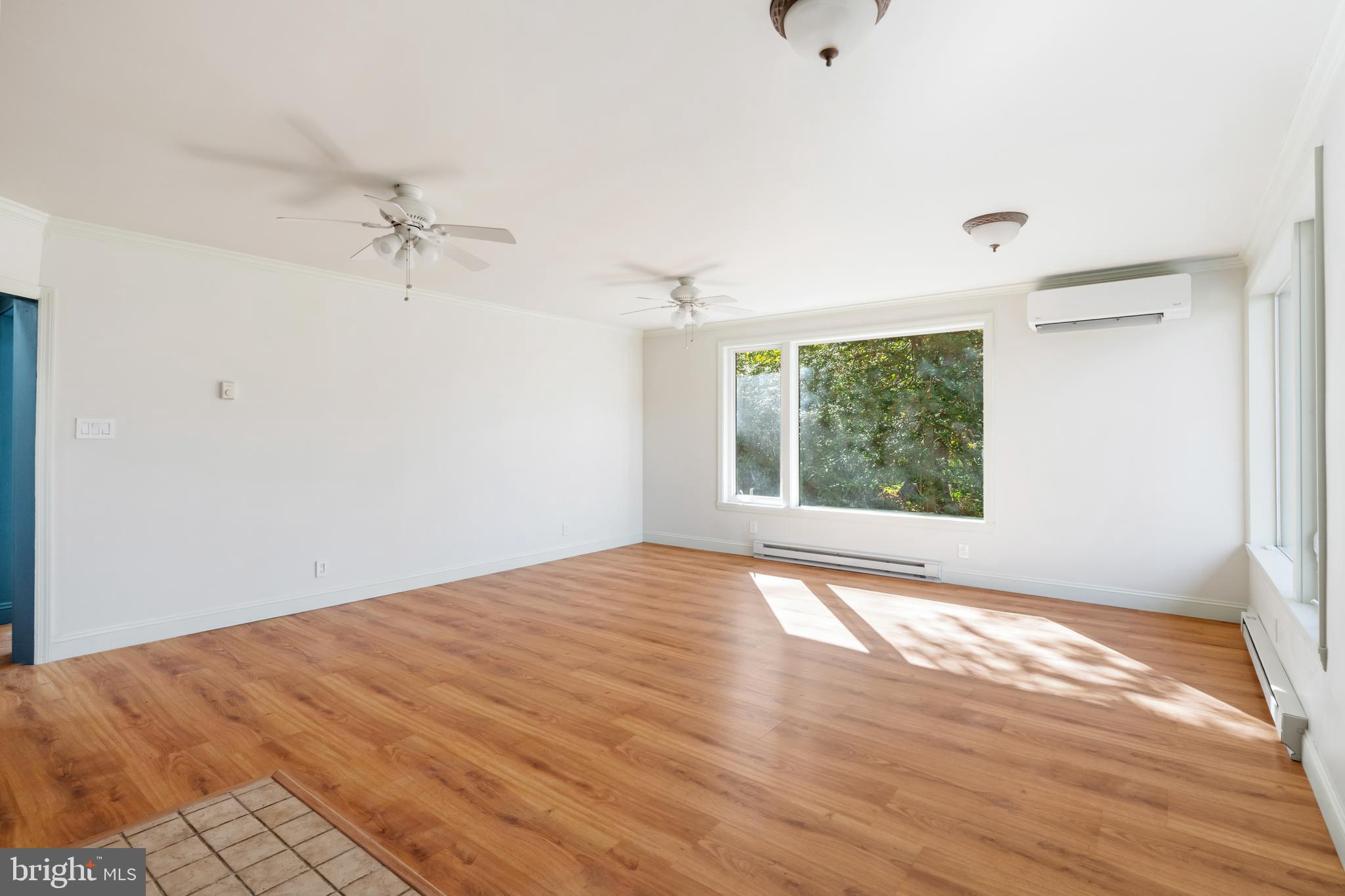 3211 Pricetown Road Fleetwood, PA 19522 - Photo 16 of 71 a view of empty room with wooden floor and fan
