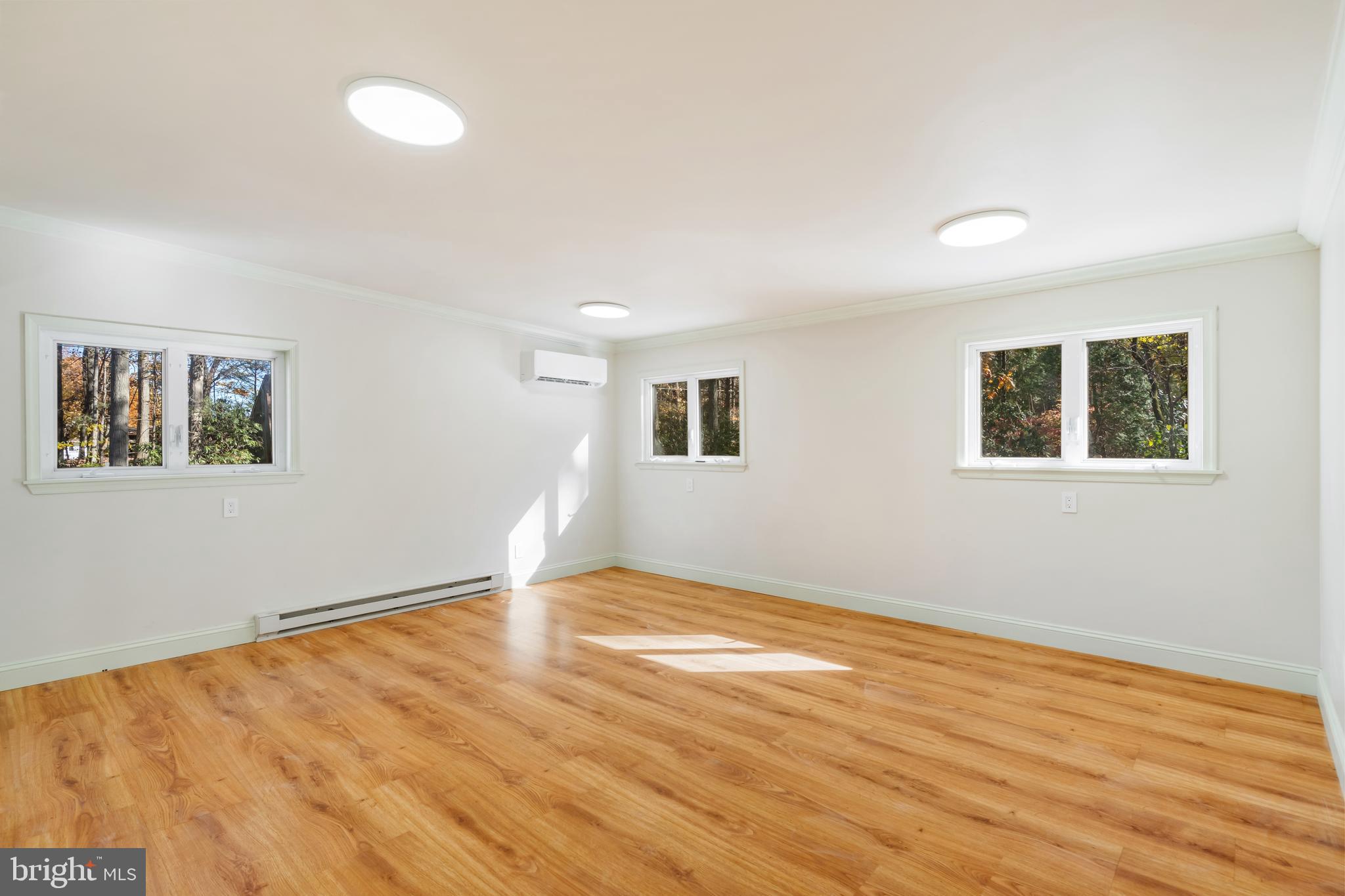 3211 Pricetown Road Fleetwood, PA 19522 - Photo 41 of 71 a view of an empty room with wooden floor and a window
