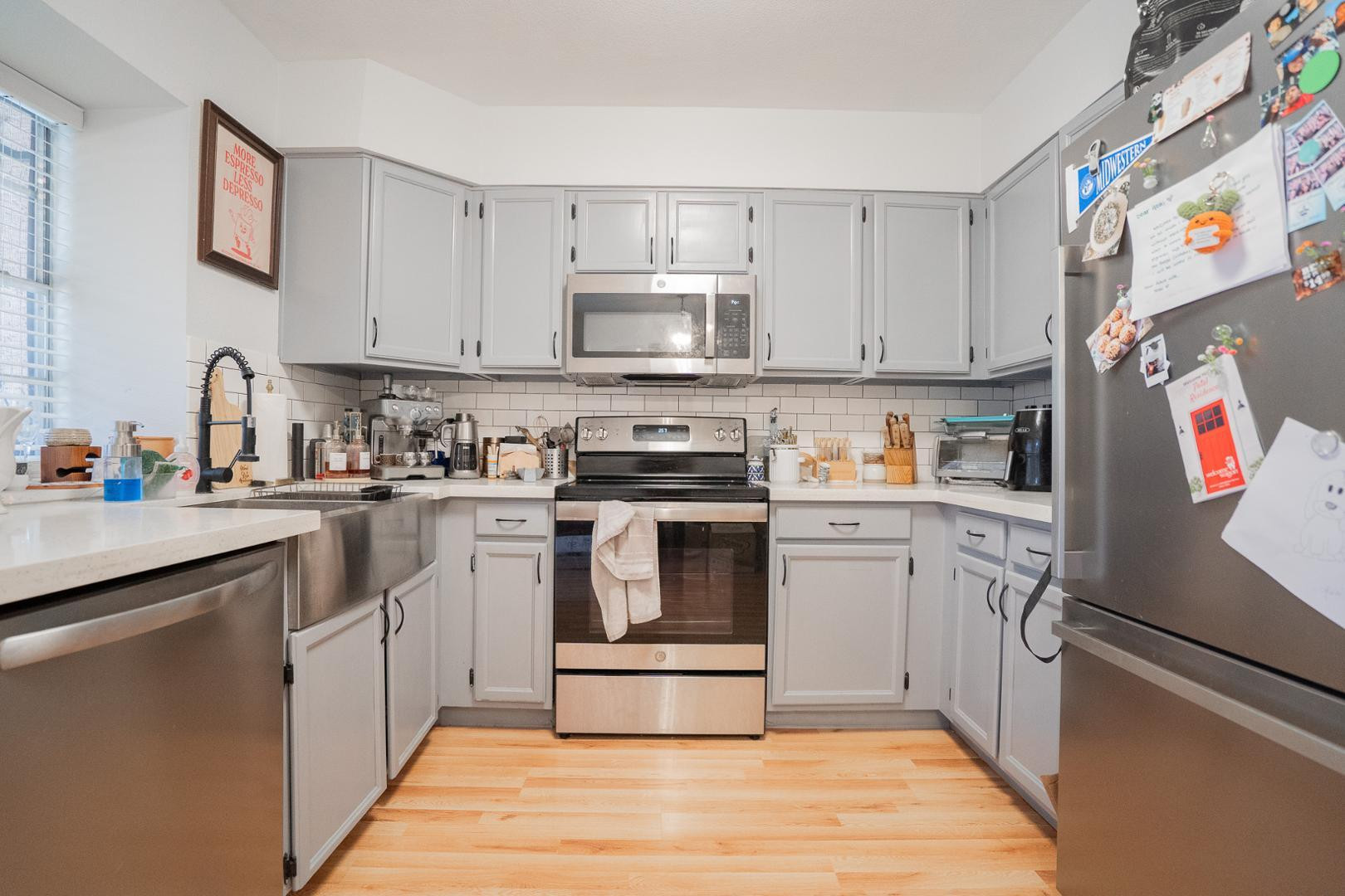 8111 West Wacker Road, Unit 70 Peoria, AZ 85381 - Photo 9 of 38 a kitchen with cabinets and stainless steel appliances