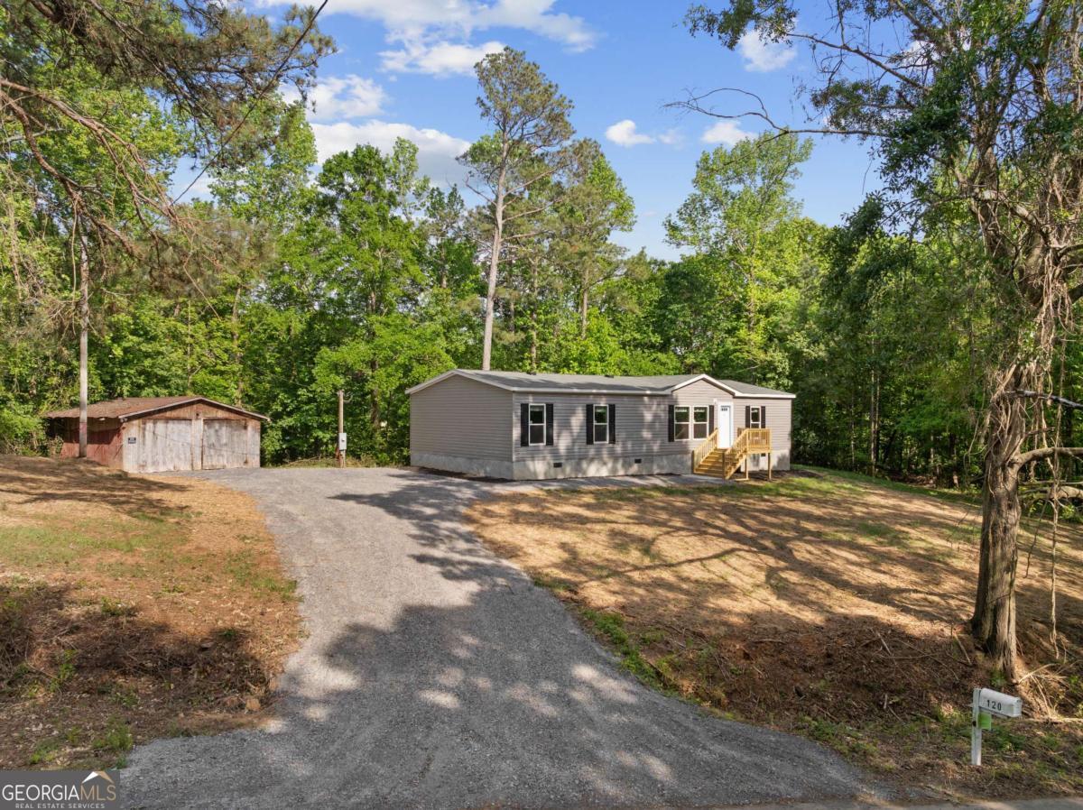 120 James Street Northwest Resaca, GA 30735 - Photo 1 of 1 a view of a house with backyard and trees