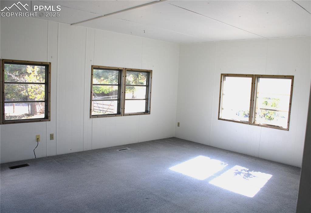 8320 Piute Road Colorado Springs, CO 80926 - Photo 7 of 20 an empty room with windows