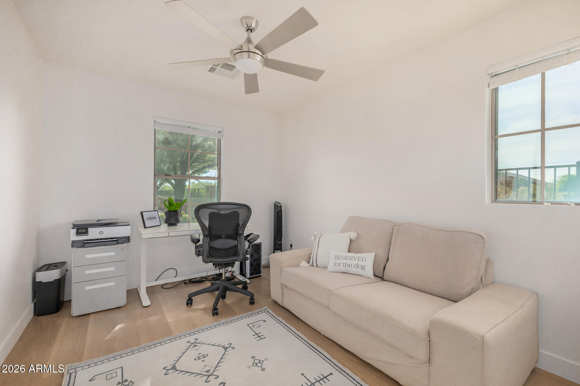 2725 East Mine Creek Road, Unit 1101 Phoenix, AZ 85024 - Photo 22 of 43 a living room with furniture and a window