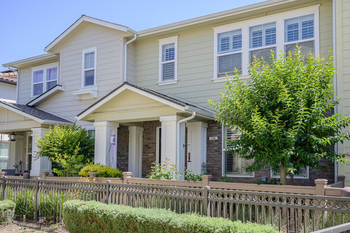 a view of a house with a yard and plants