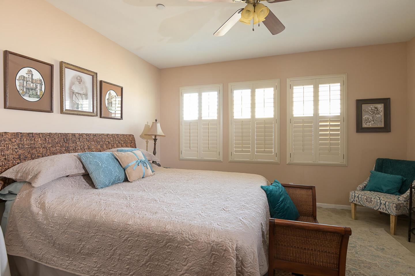 124 Larkspur Loop Morgan Hill, CA 95037 - Photo 15 of 26 a bedroom with a bed and wooden floor