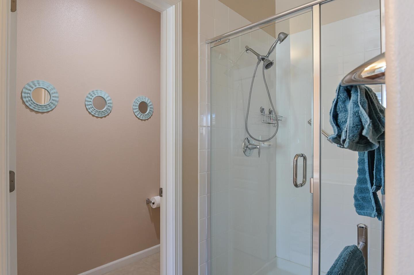 124 Larkspur Loop Morgan Hill, CA 95037 - Photo 18 of 26 a bathroom with a glass shower door