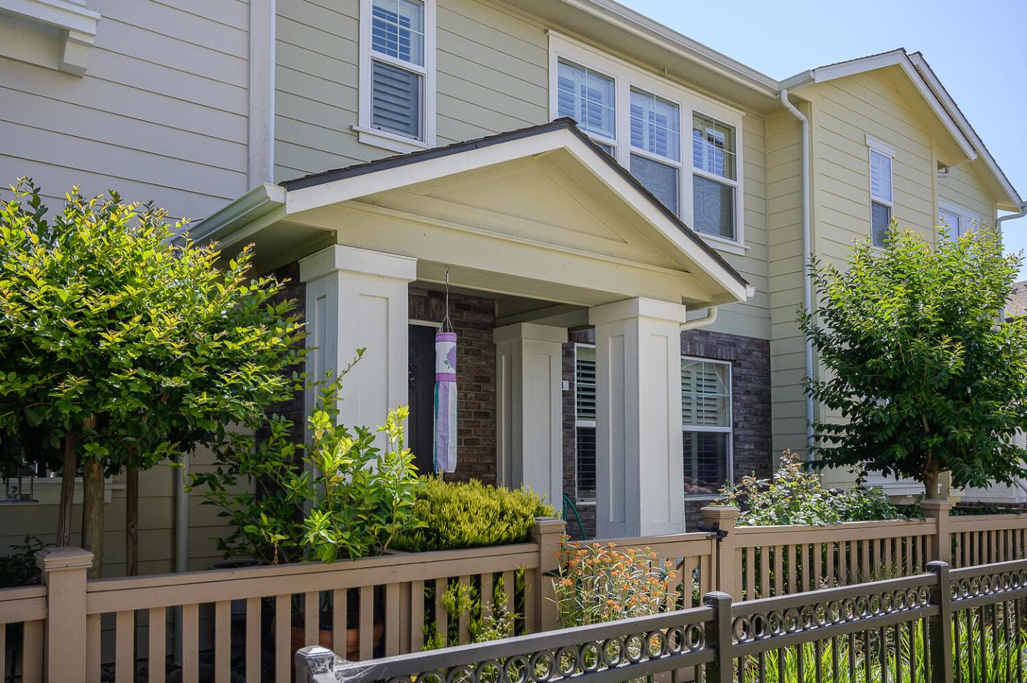 124 Larkspur Loop Morgan Hill, CA 95037 - Photo 2 of 26 a view of a house with large windows and a small yard