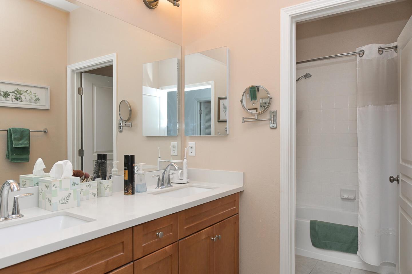 124 Larkspur Loop Morgan Hill, CA 95037 - Photo 22 of 26 a bathroom with a sink and a mirror