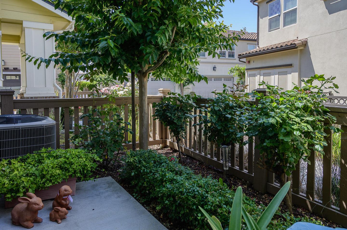 124 Larkspur Loop Morgan Hill, CA 95037 - Photo 3 of 26 a house with potted plants in front of it