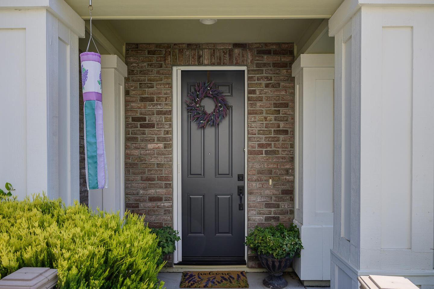 124 Larkspur Loop Morgan Hill, CA 95037 - Photo 4 of 26 a front view of a house with a yard