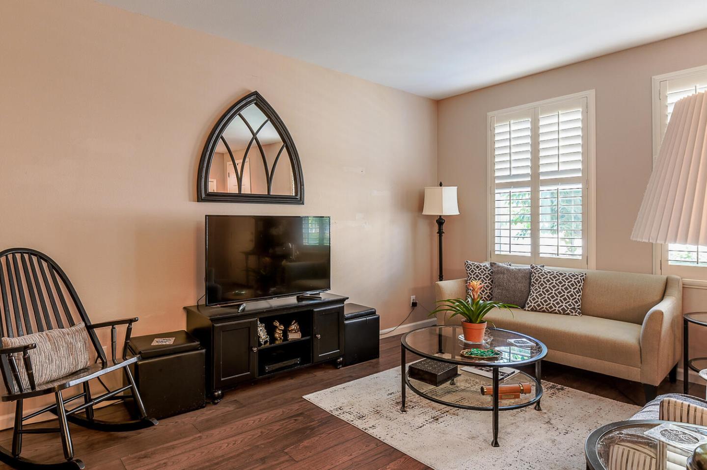 124 Larkspur Loop Morgan Hill, CA 95037 - Photo 7 of 26 a living room with furniture and a flat screen tv with wooden floor