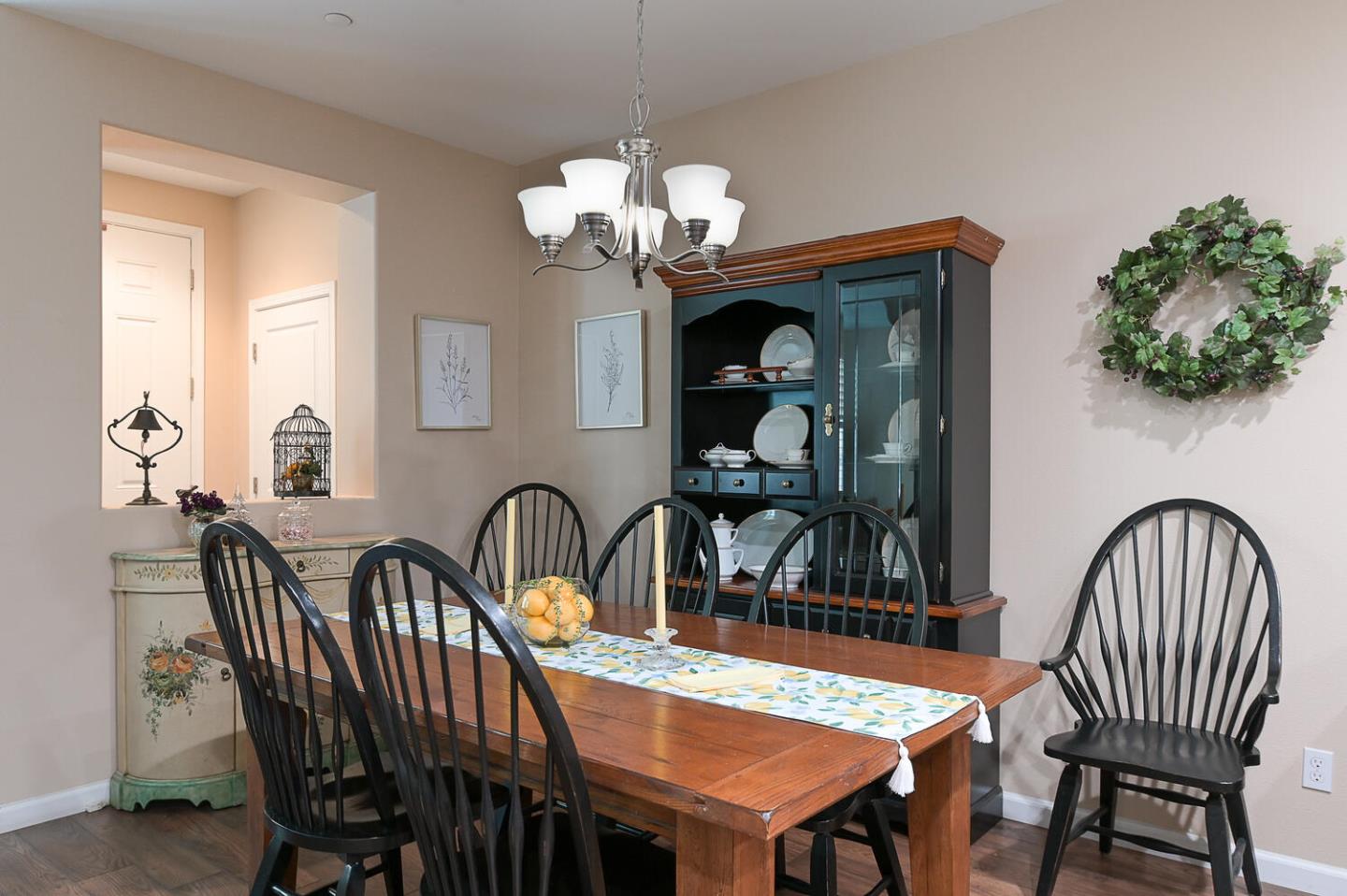 124 Larkspur Loop Morgan Hill, CA 95037 - Photo 9 of 26 a dining room with furniture a chandelier and window