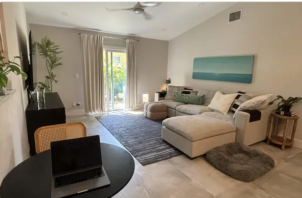 a living room with furniture and a window