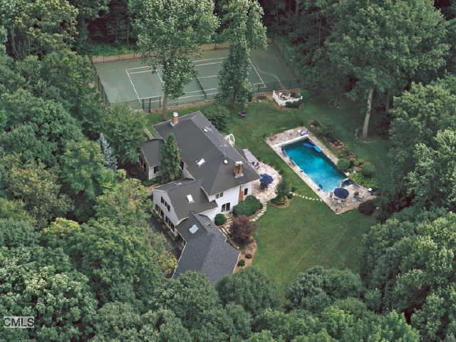 an aerial view of a house with outdoor space and street view