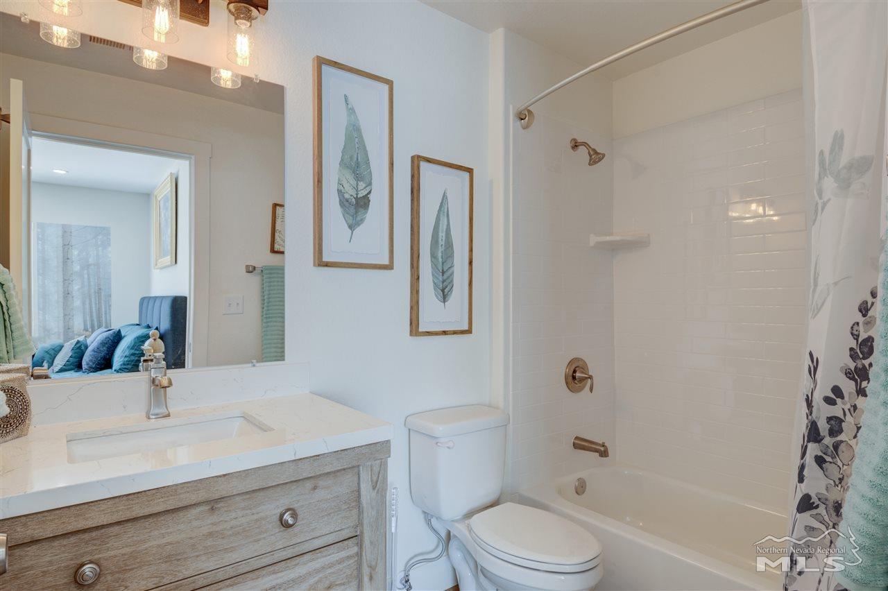 2160 Dickerson Road Reno, NV 89503 - Photo 12 of 35 a bathroom with a sink a toilet and shower