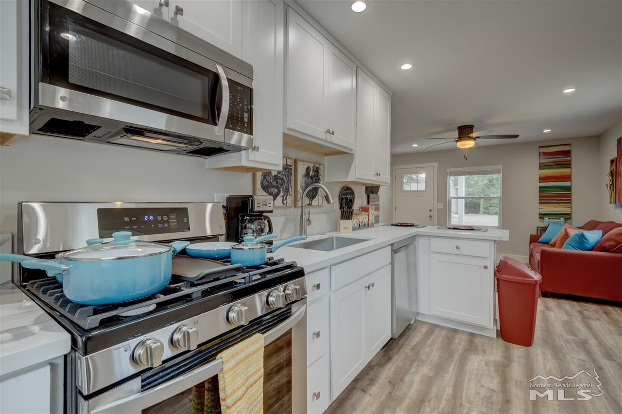 2160 Dickerson Road Reno, NV 89503 - Photo 17 of 35 a kitchen with stainless steel appliances granite countertop a stove and a sink