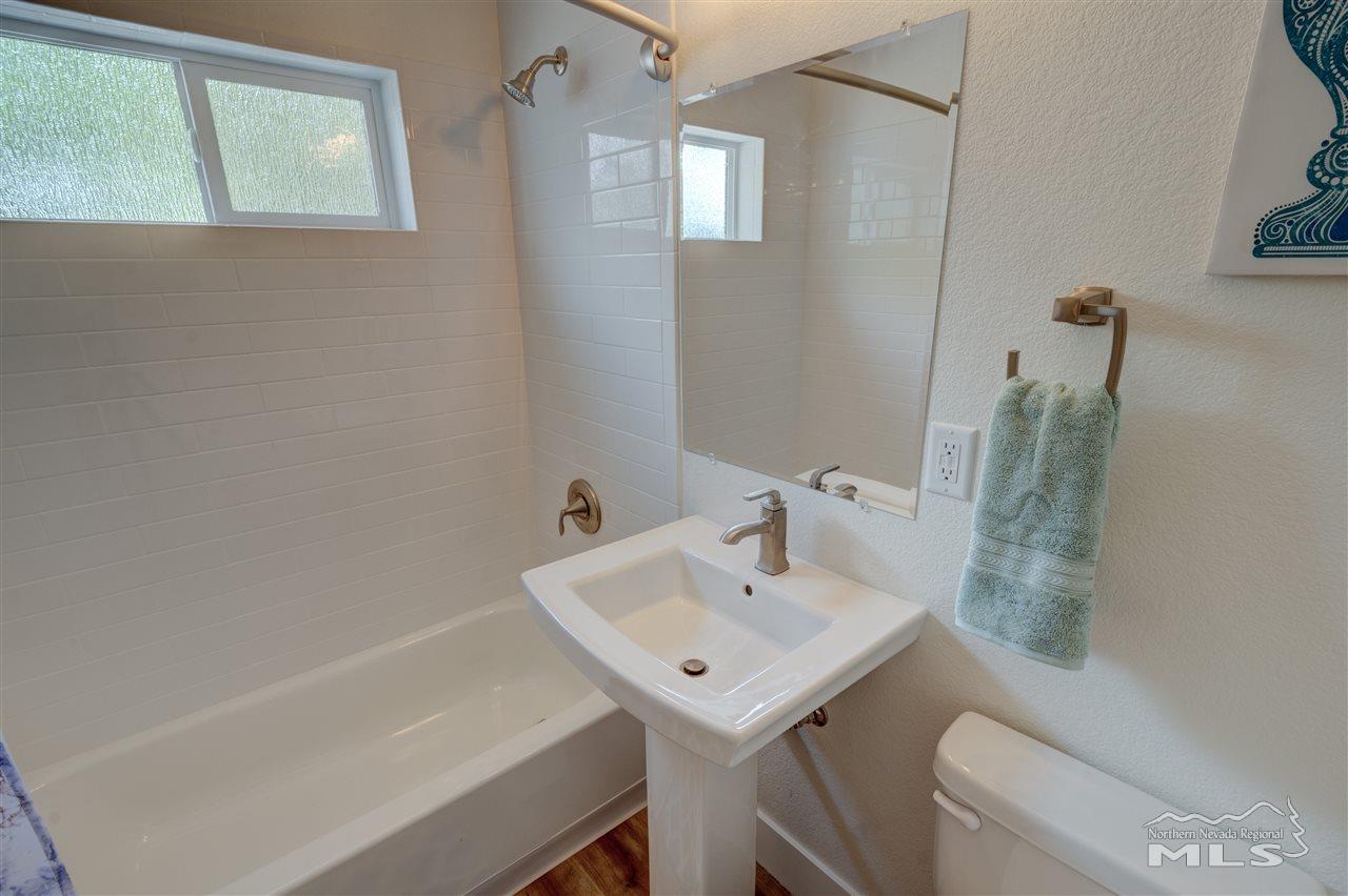 2160 Dickerson Road Reno, NV 89503 - Photo 21 of 35 a bathroom with a sink a toilet and shower