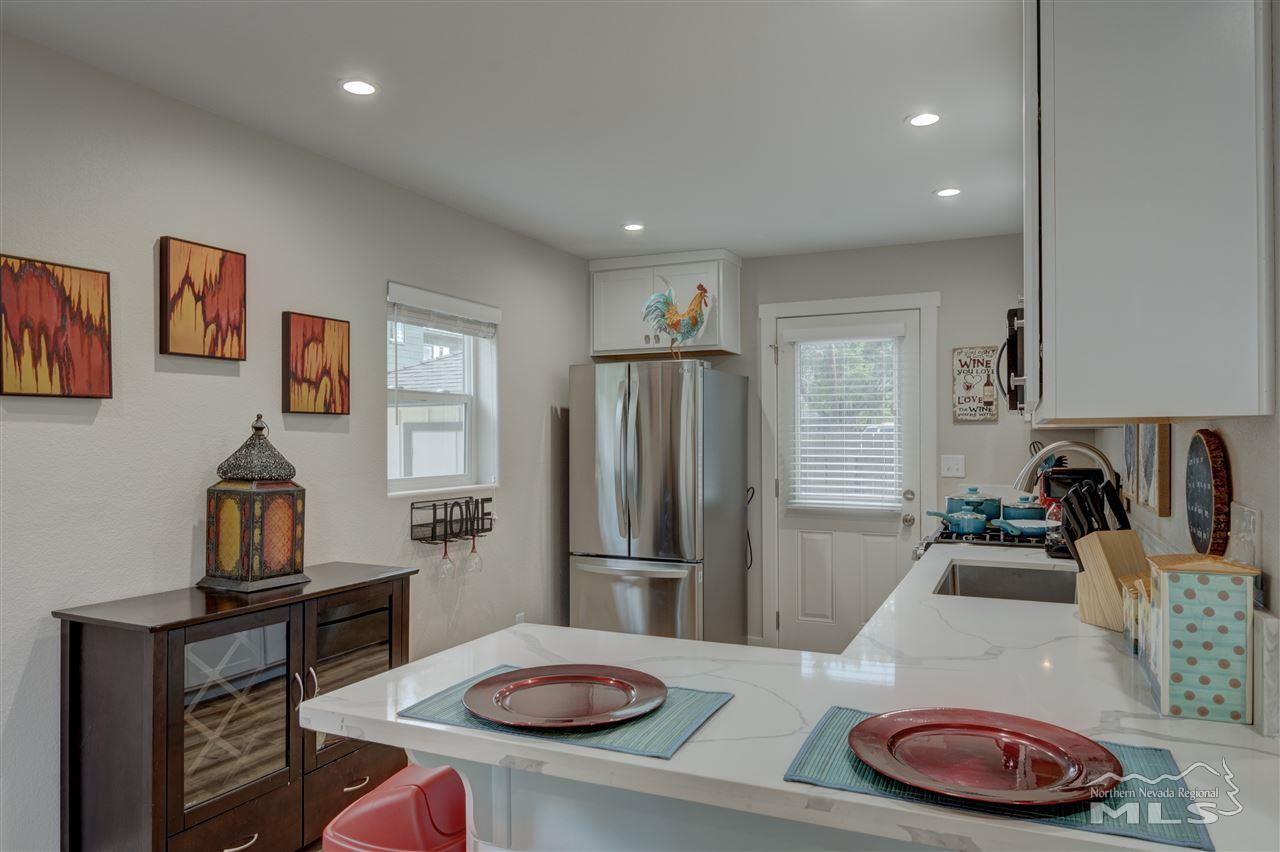 2160 Dickerson Road Reno, NV 89503 - Photo 23 of 35 a kitchen with sink refrigerator and stove