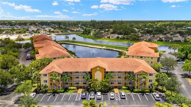 an aerial view of a houses with outdoor space and lake view