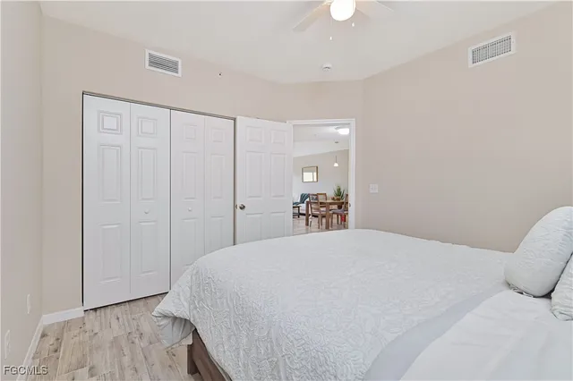 a bedroom with a bed and a closet