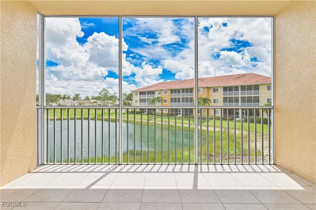 a view of a balcony with a floor to ceiling window
