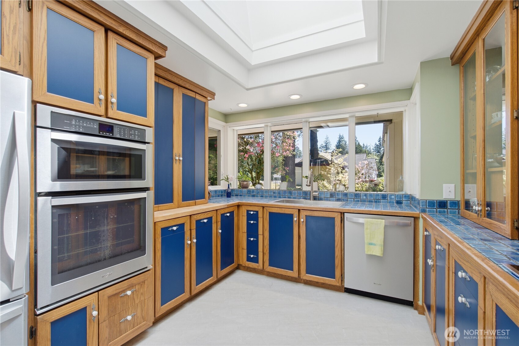 3050 Southeast Mullenix Road Port Orchard, WA 98367 - Photo 10 of 40 a kitchen with stainless steel appliances granite countertop a stove and a microwave
