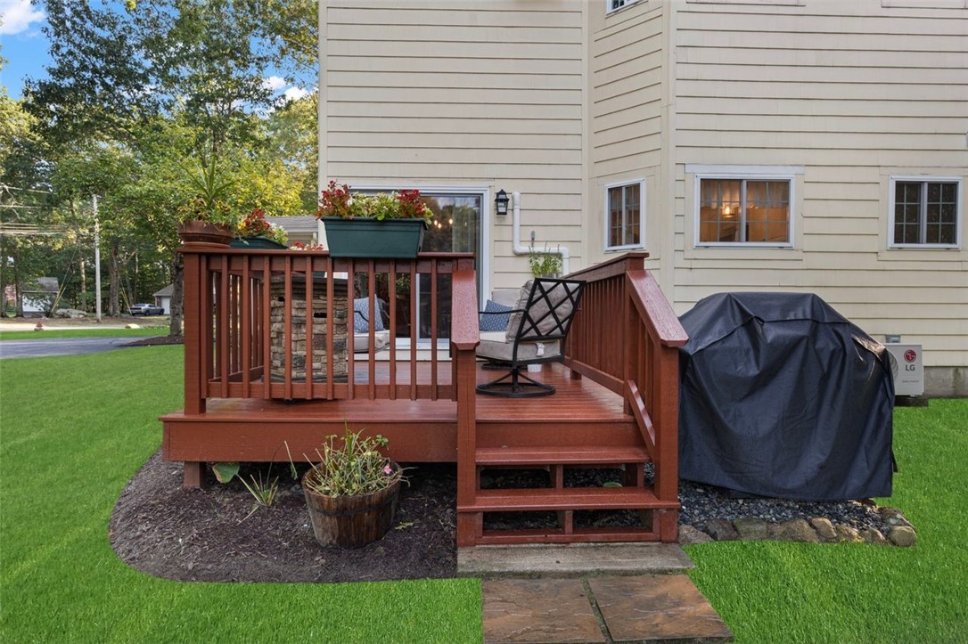 34 Eagle Run, Unit 34B Warwick, RI 02818 - Photo 22 of 23 Deck with steps down to the yard. (Grass has been digitally enhanced)