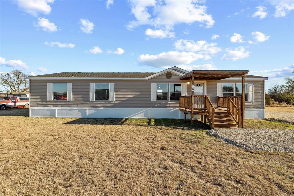 237 Quarterhorse Road Waxahachie, TX 75165 - Photo 1 of 38 a backyard of a house with barbeque oven table and chairs