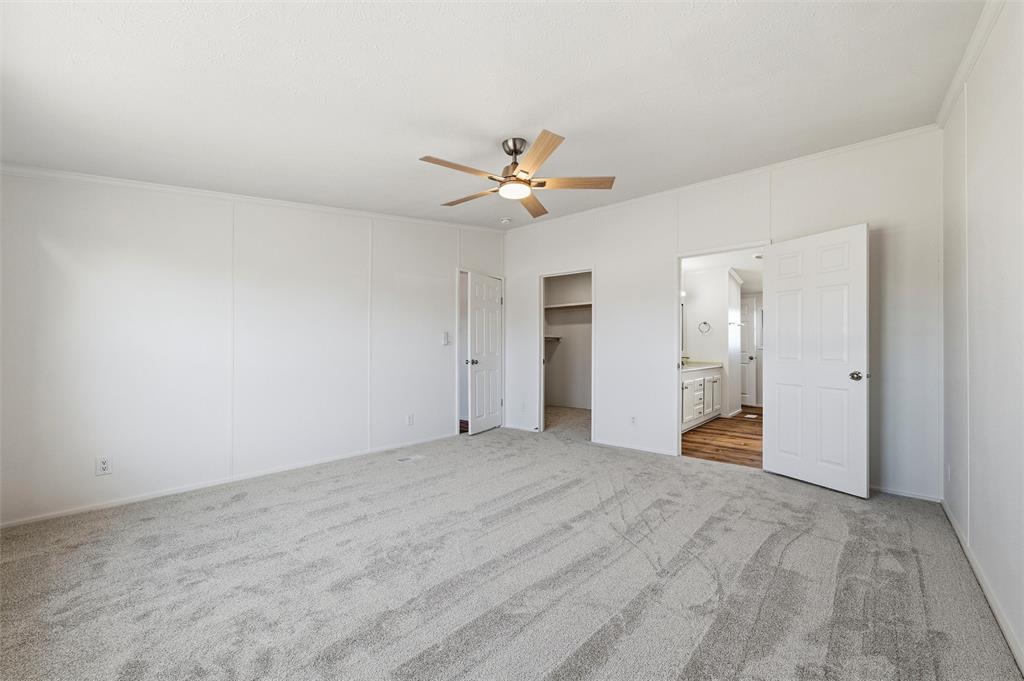 237 Quarterhorse Road Waxahachie, TX 75165 - Photo 20 of 38 an empty room with closet and a ceiling fan