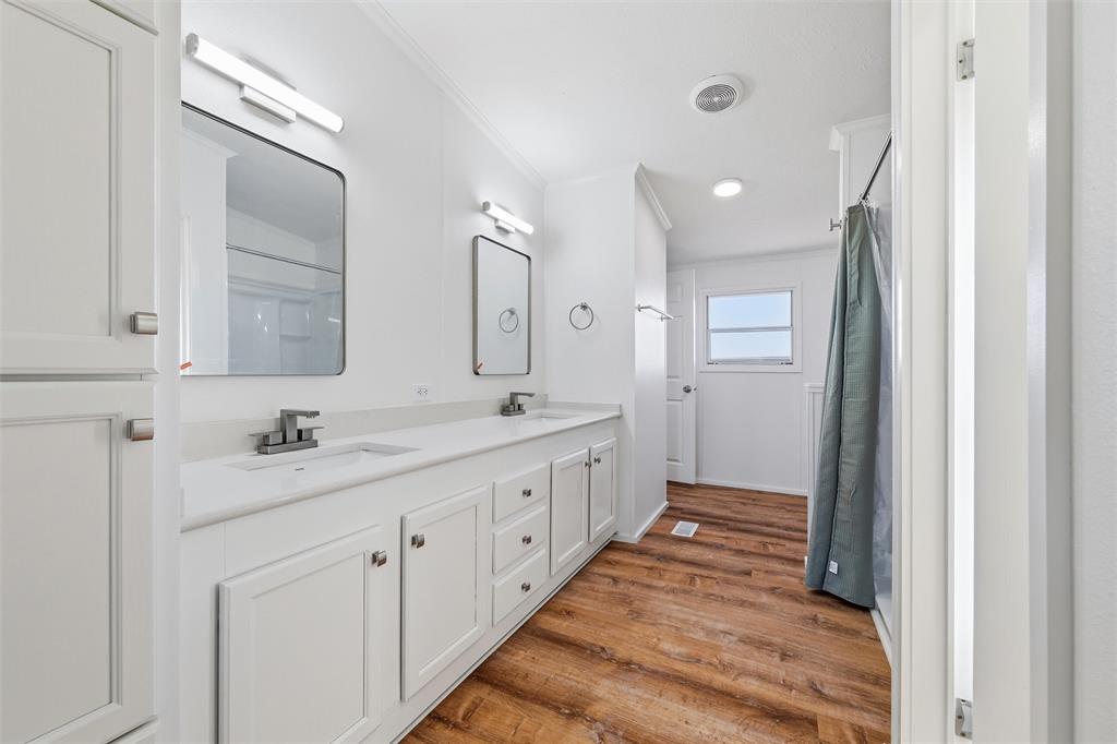 237 Quarterhorse Road Waxahachie, TX 75165 - Photo 22 of 38 a bathroom with a double vanity sink and mirror