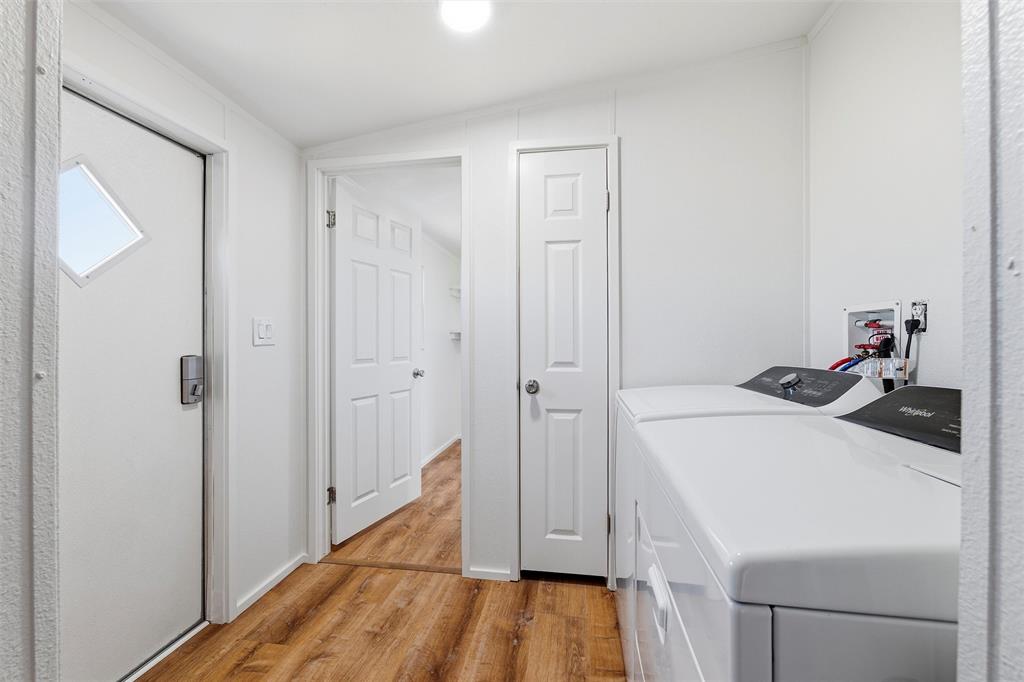 237 Quarterhorse Road Waxahachie, TX 75165 - Photo 25 of 38 a kitchen with a sink and wooden floor