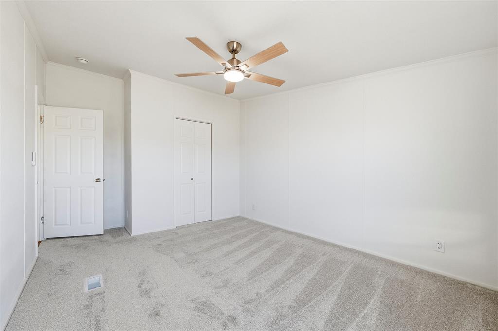 237 Quarterhorse Road Waxahachie, TX 75165 - Photo 26 of 38 an empty room with closet and fan