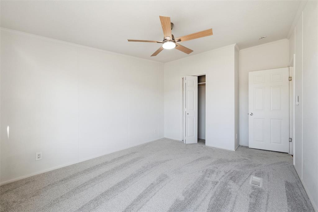 237 Quarterhorse Road Waxahachie, TX 75165 - Photo 28 of 38 an empty room with closet and fan