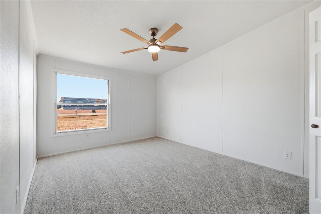 237 Quarterhorse Road Waxahachie, TX 75165 - Photo 29 of 38 an empty room with windows and fan