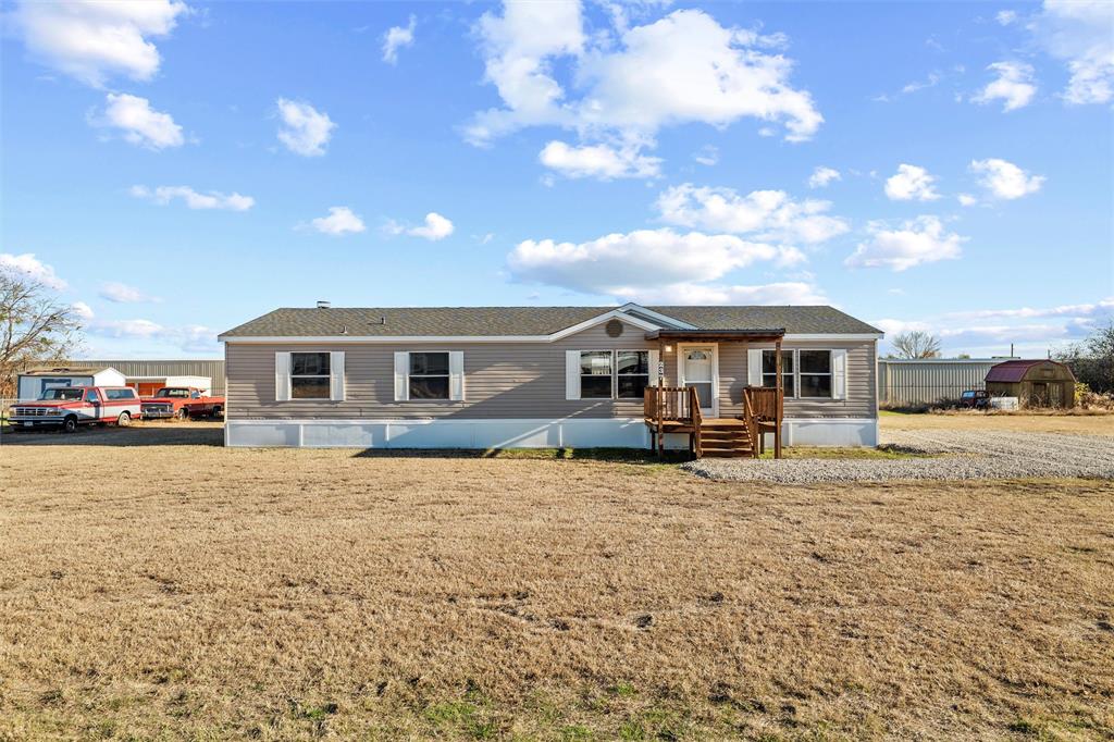 237 Quarterhorse Road Waxahachie, TX 75165 - Photo 3 of 38 a front view of a house with a yard