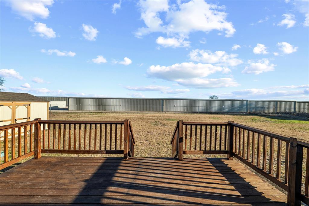 237 Quarterhorse Road Waxahachie, TX 75165 - Photo 34 of 38 a view of deck with wooden floor and fence