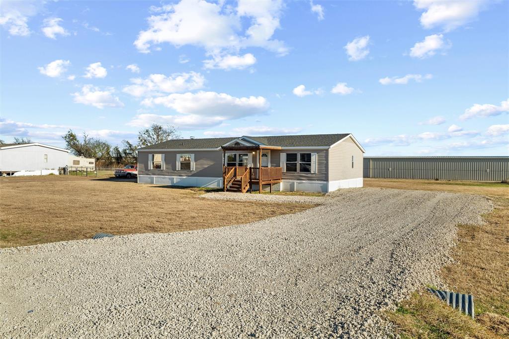 237 Quarterhorse Road Waxahachie, TX 75165 - Photo 4 of 38 a view of house with outdoor space and sitting space