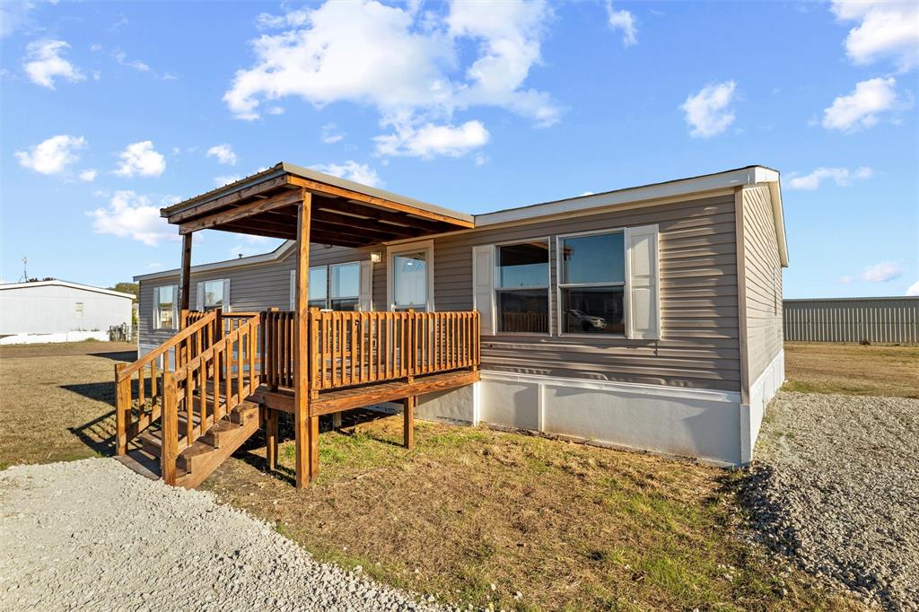 237 Quarterhorse Road Waxahachie, TX 75165 - Photo 6 of 38 a view of house with a roof deck