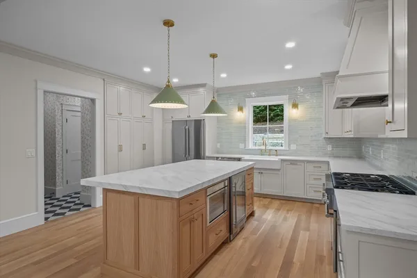 a kitchen with a sink stove and refrigerator