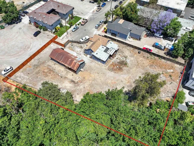 an aerial view of residential house with an outdoor space