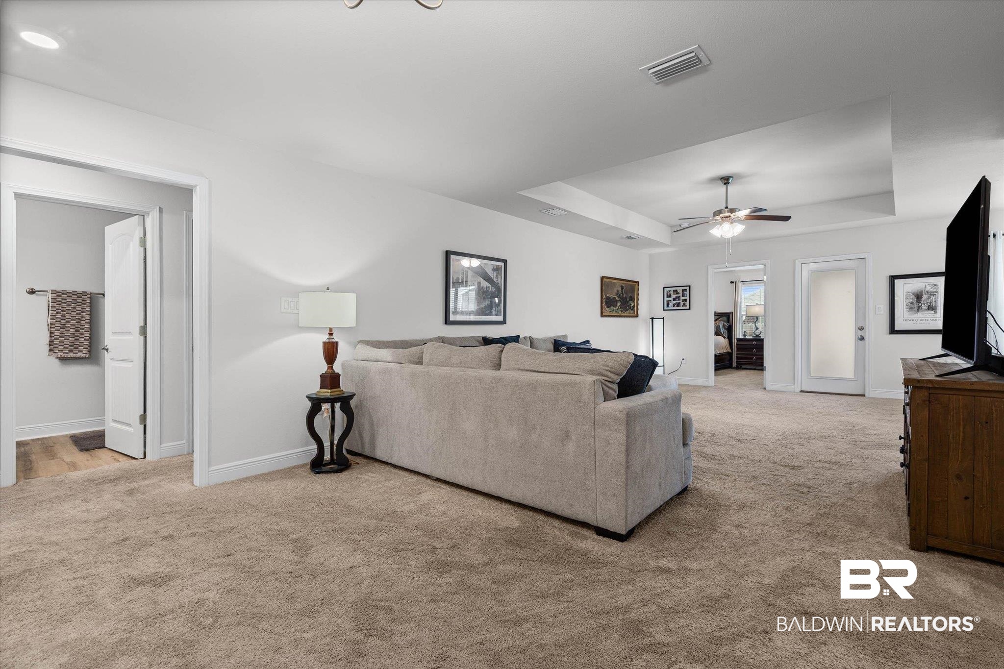 22420 Respite Lane Foley, AL 36535 - Photo 2 of 35 Spacious carpeted room featuring a tray ceiling, recessed lighting, and a ceiling fan